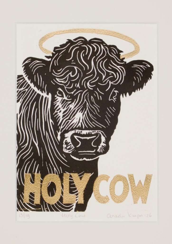 The finished *Holy Cow* linoprint, with a shiny gold embossed halo.