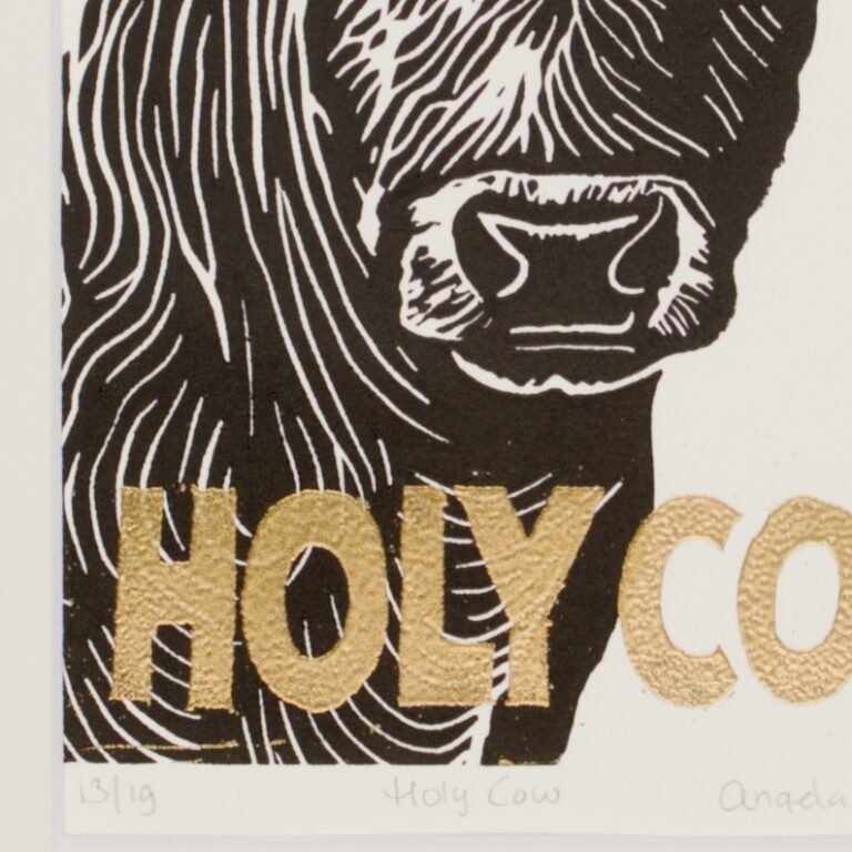 Detail of gold embossing on the Holy Cow print