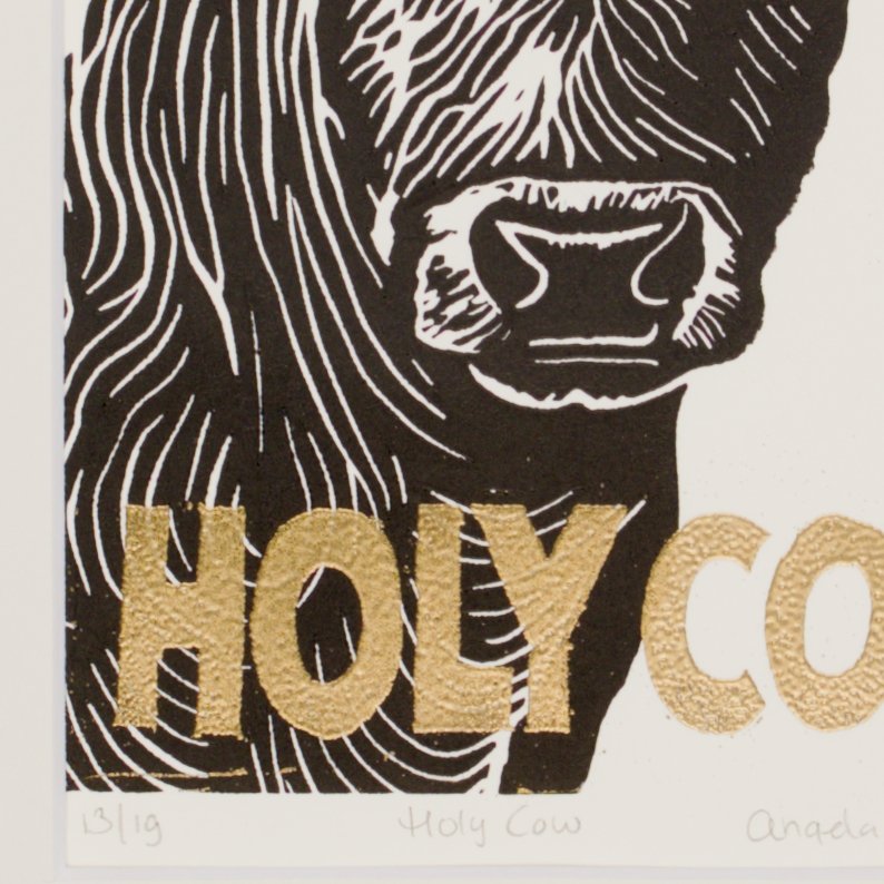 Detail of gold embossing on the Holy Cow print
